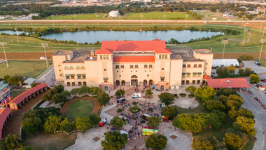 Overhead shot of Retama Park with parking lot and racetrack